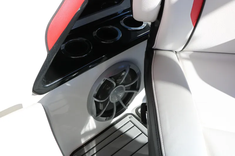 Slide: The Image of 2018 Yamaha Boats 242X E-Series interior with speaker and cup holders. - 43