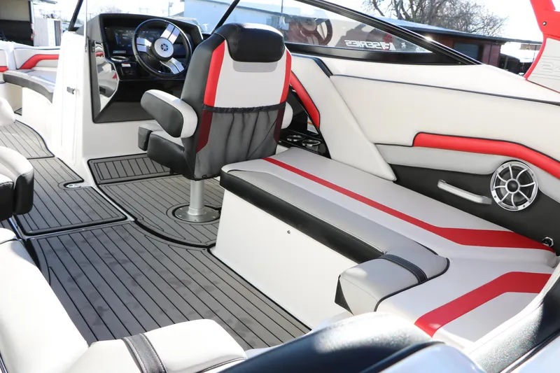 Slide: The Image of 2018 Yamaha Boats 242X E-Series interior with sleek seating and modern dashboard design. - 46