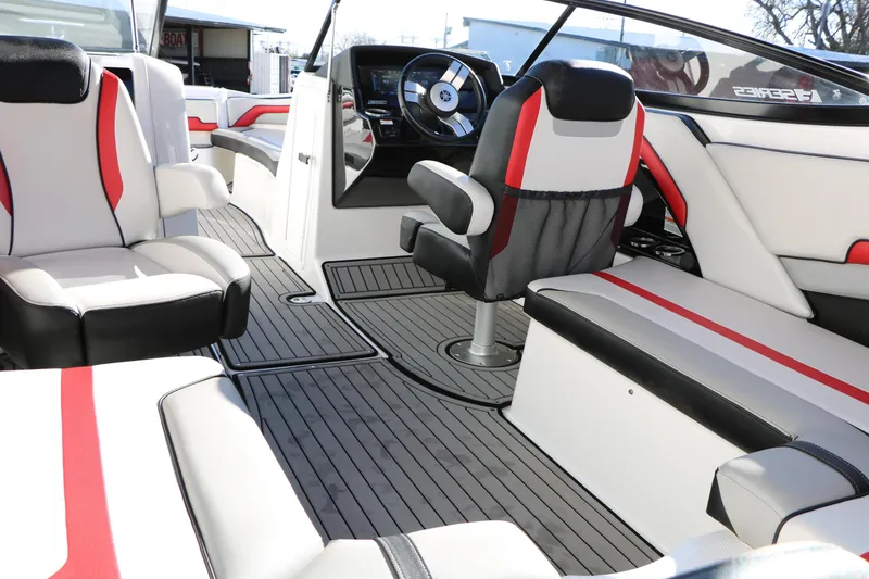 Slide: The Image of 2018 Yamaha Boats 242X E-Series interior with sleek seating and modern dashboard design. - 47