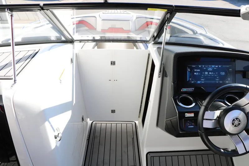 Slide: The Image of 2018 Yamaha Boats 242X E-Series cockpit with modern dashboard and steering wheel. - 50