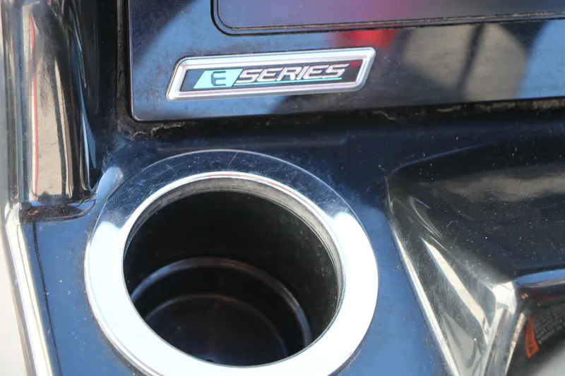 Slide: The Image of Close-up of 2018 Yamaha Boats 242X E-Series dashboard with cup holder. - 51