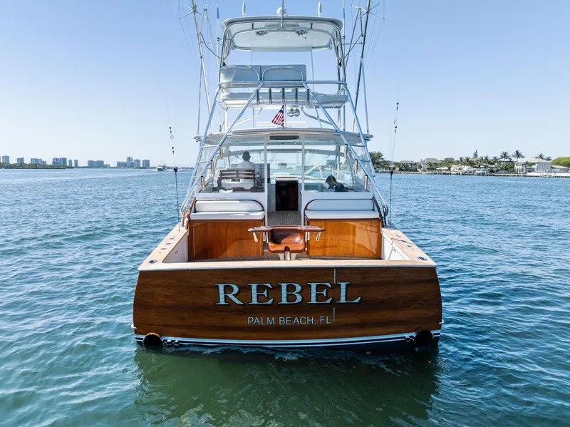 Slide: The Image of Rybovich Sportfish 2000 boat named "Rebel" on water, Palm Beach, FL. - 11