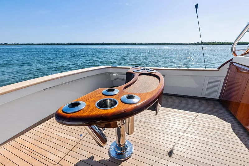 Slide: The Image of Rybovich Sportfish 2000 yacht deck with wooden fighting chair overlooking the ocean. - 22