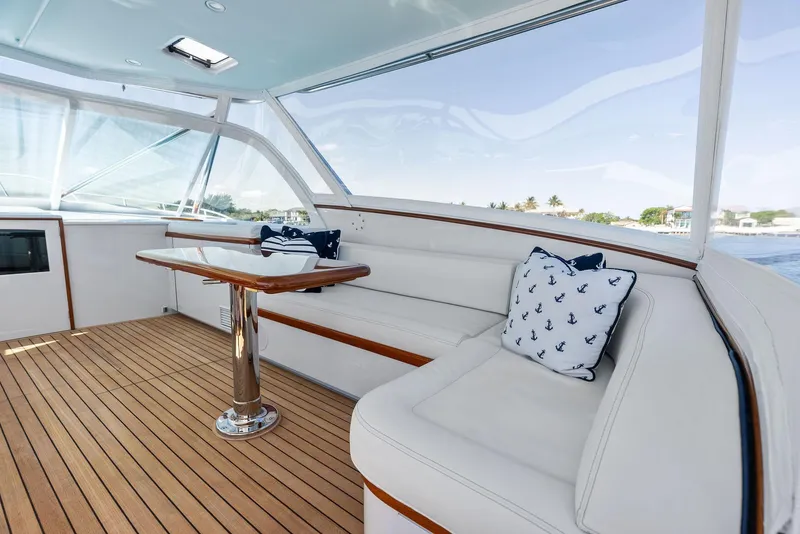 Slide: The Image of Luxurious interior of a 2000 Rybovich Sportfish yacht with elegant seating and nautical decor. - 26