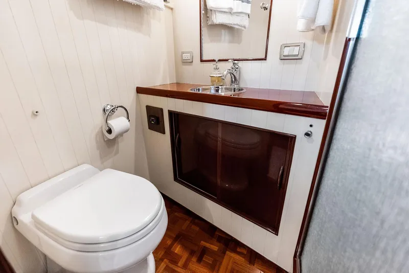 Slide: The Image of Bathroom interior of a 2000 Rybovich Sportfish yacht with wood accents and modern fixtures. - 39