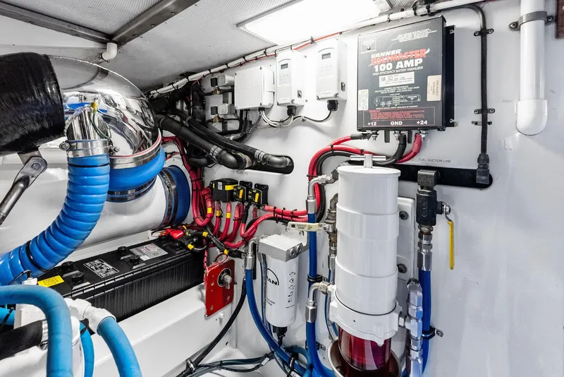 Slide: The Image of Engine room of a 2000 Rybovich Express with wiring and equipment. - 49