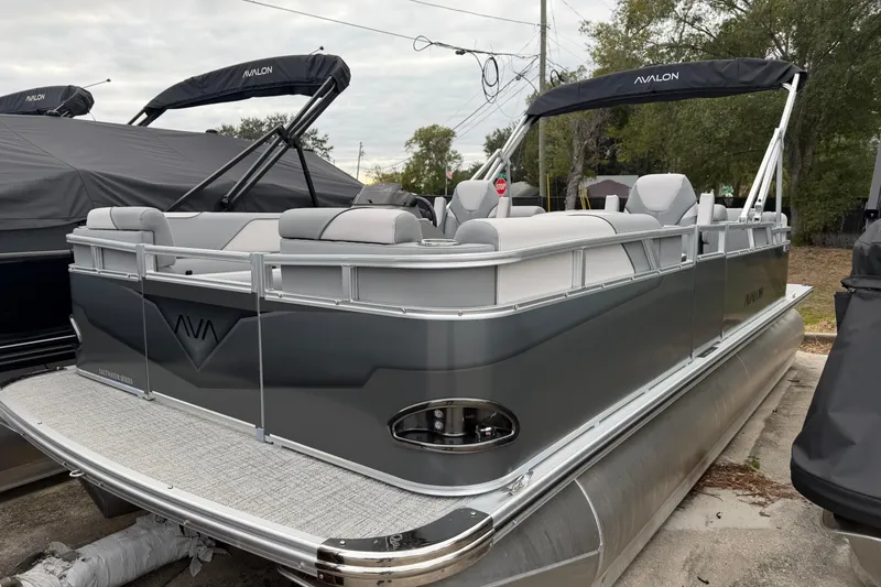 The Image of 2026 Avalon VENTURE QUAD LOUNGER pontoon boat, sleek design, gray exterior, spacious seating. - 1