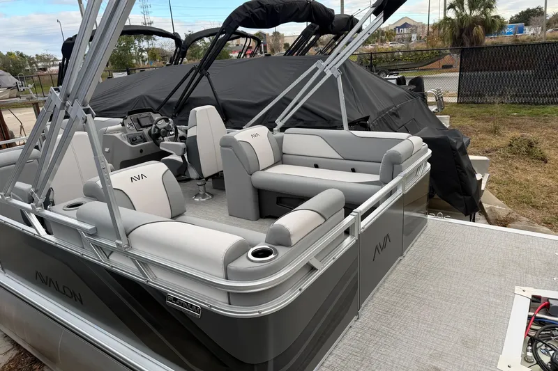 Slide: The Image of 2026 Avalon VENTURE QUAD LOUNGER pontoon boat with sleek seating and modern design. - 6