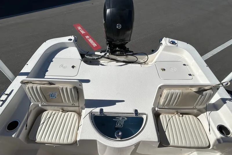 Slide: The Image of 2017 Carolina Skiff 258 DLV boat interior with seating and motor. - 12