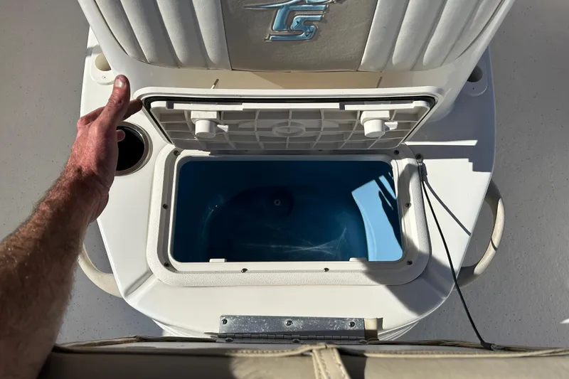 Slide: The Image of 2017 Carolina Skiff 258 DLV livewell with open lid, showcasing interior. - 14