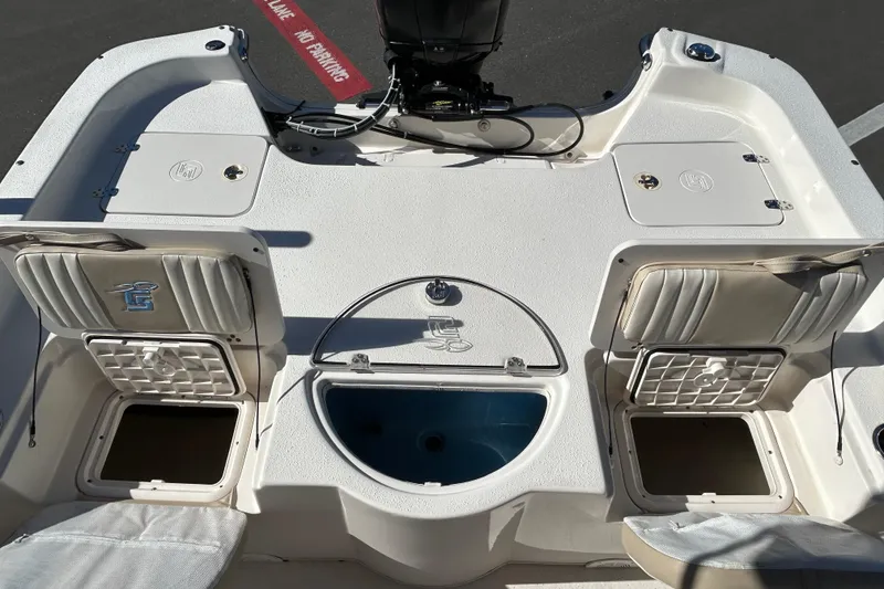 Slide: The Image of 2017 Carolina Skiff 258 DLV boat interior with storage compartments and seating. - 15