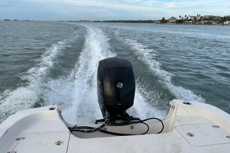 Slide: The Image of 2017 Carolina Skiff 258 DLV boat cruising on open water, leaving a wake behind. - 20