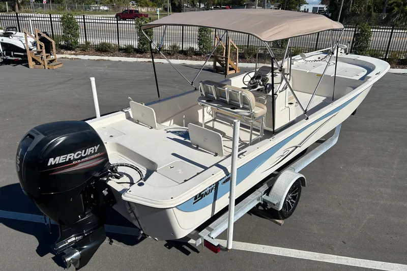Slide: The Image of 2017 Carolina Skiff 258 DLV boat with Mercury engine on trailer. - 7