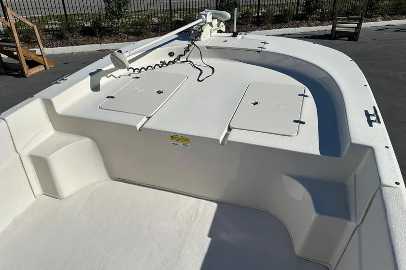 Slide: The Image of 2017 Carolina Skiff 258 DLV boat deck with storage compartments and trolling motor. - 8