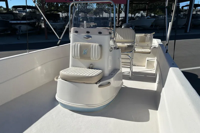Slide: The Image of 2017 Carolina Skiff 258 DLV boat interior with seating and console. - 9