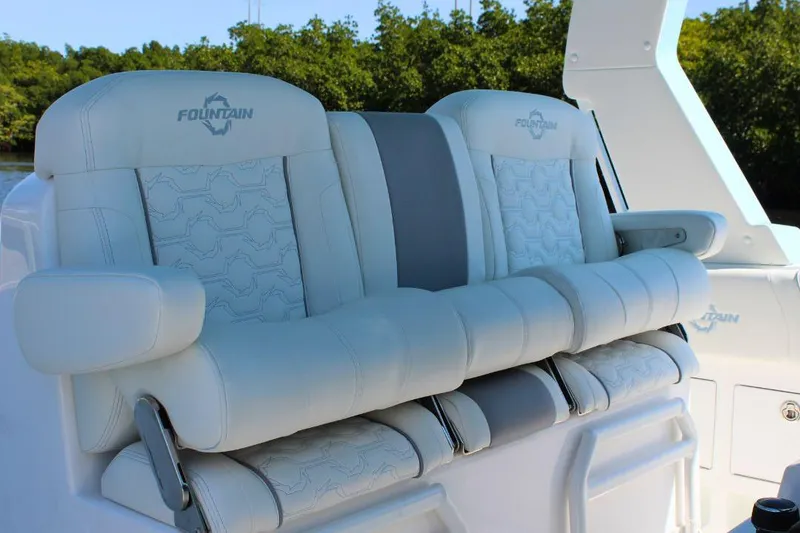 Slide: The Image of Luxury seating on 2025 Fountain 38 SCX boat, featuring elegant white upholstery. - 13