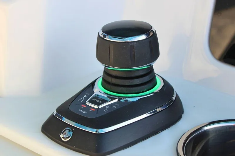 Slide: The Image of Joystick control on 2025 Fountain 38 SCX boat dashboard, featuring illuminated buttons. - 17