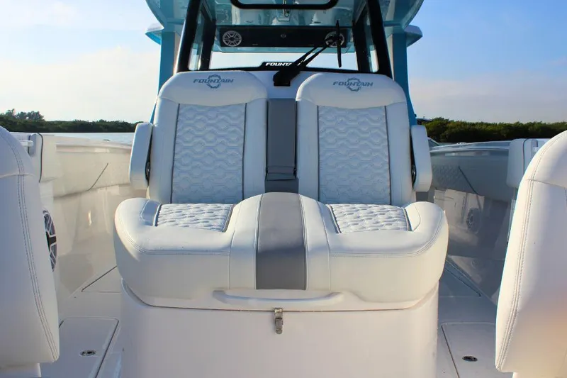 Slide: The Image of 2025 Fountain 38 SCX boat interior with luxurious white seating and modern design. - 26