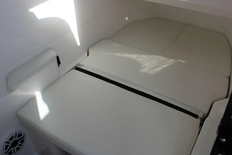 Slide: The Image of 2025 Fountain 38 SCX cabin interior with cushioned seating and speaker. - 29
