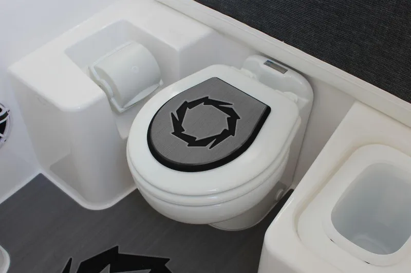 Slide: The Image of 2025 Fountain 38 SCX boat bathroom with modern toilet and sleek design. - 31