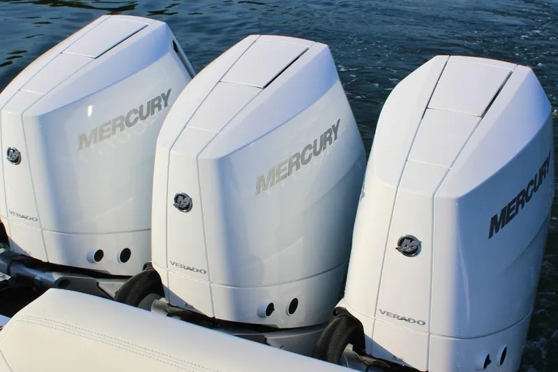 Slide: The Image of Triple Mercury Verado outboard engines on a 2025 Fountain 38 SCX boat. - 7