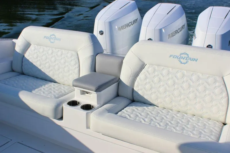 Slide: The Image of Luxury seating on 2025 Fountain 38 SCX boat with Mercury engines in background. - 8