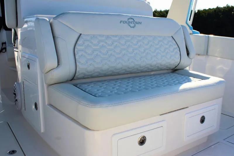 Slide: The Image of Luxurious seating on 2025 Fountain 38 SCX boat with elegant design and storage. - 9