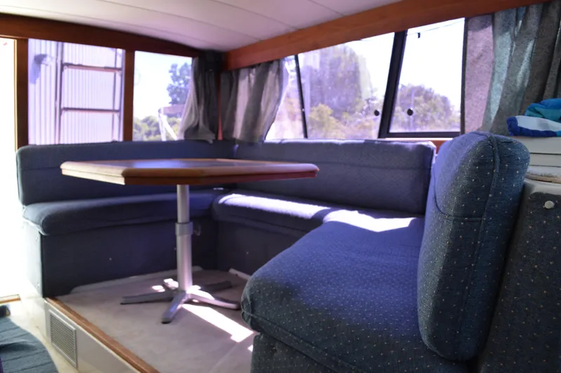 Slide: The Image of Interior of 1990 Bayliner 3888 Motoryacht with blue upholstery. - 11