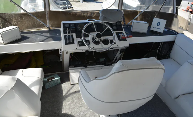 Slide: The Image of Interior view of 1990 Bayliner 3888 Motoryacht helm station. - 13