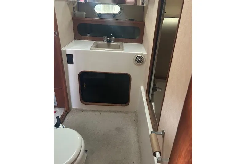 Slide: The Image of Bathroom interior of 1990 Bayliner 3888 Motoryacht with sink and toilet. - 28