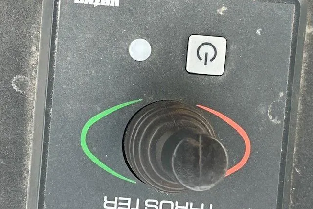 Slide: The Image of Control panel of a 1990 Bayliner 3888 Motoryacht with joystick and power button. - 31