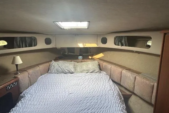Slide: The Image of 1990 Bayliner 3888 Motoryacht interior cabin with bed and skylight. - 35