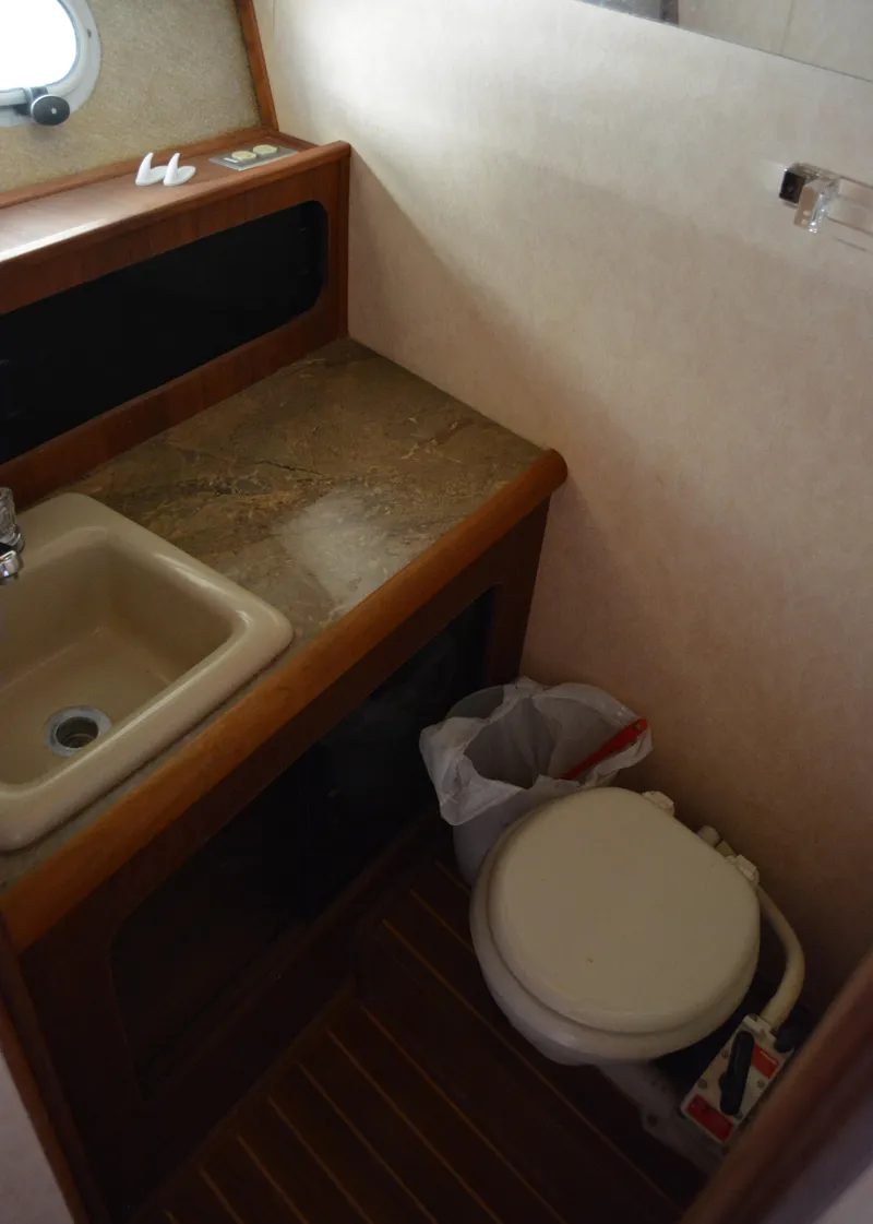 Slide: The Image of 1990 Bayliner 3888 Motoryacht bathroom with sink and toilet. - 9
