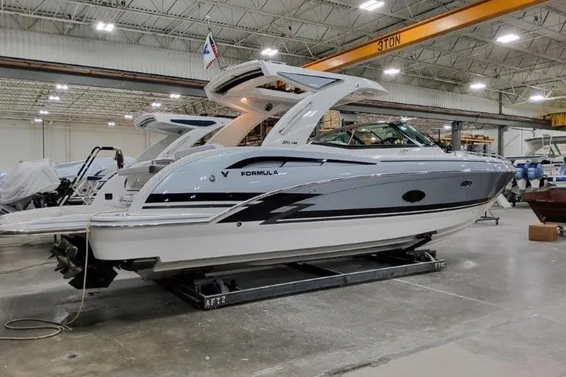 The Image of 2025 Formula 350 Crossover Bowrider I/O in a showroom, showcasing sleek design and modern features. - 0
