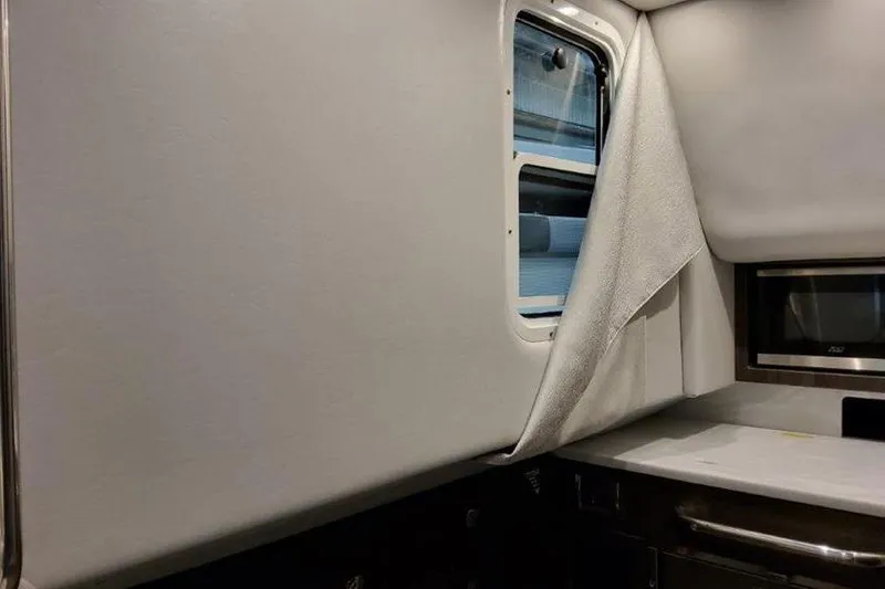 Slide: The Image of Interior of 2025 Formula 350 Crossover Bowrider I/O with window and countertop. - 11