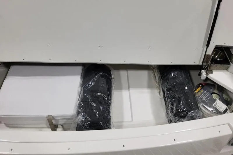 Slide: The Image of Storage compartment in 2025 Formula 350 Crossover Bowrider I/O boat. - 24
