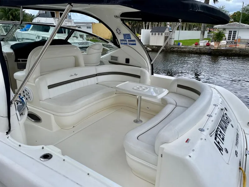 Slide: The Image of 2007 Sea Ray 44 Sundancer yacht with spacious white seating area and table. - 11