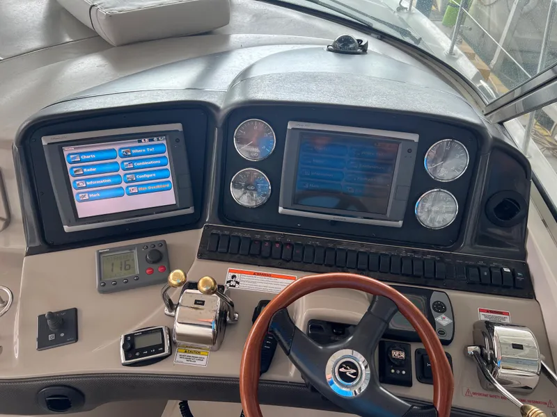 Slide: The Image of Helm of a 2007 Sea Ray 44 Sundancer with dual displays and controls. - 22