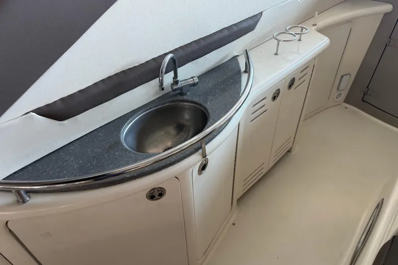 Slide: The Image of 2007 Sea Ray 44 Sundancer yacht interior with sink and storage cabinets. - 36