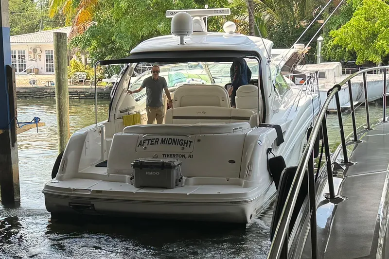 Slide: The Image of 2007 Sea Ray 44 Sundancer docked with people onboard, named After Midnight. - 4