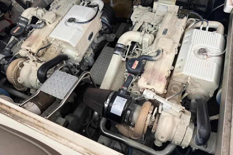 Slide: The Image of Engine compartment of a 2007 Sea Ray 44 Sundancer boat, featuring twin engines. - 43