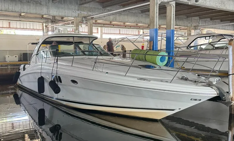 Slide: The Image of 2007 Sea Ray 44 Sundancer yacht docked in a marina. - 9