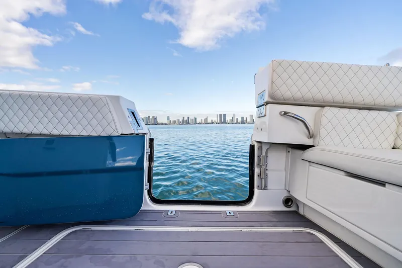 Slide: The Image of 2023 HCB 42 Lujo boat interior with city skyline view over water. - 13