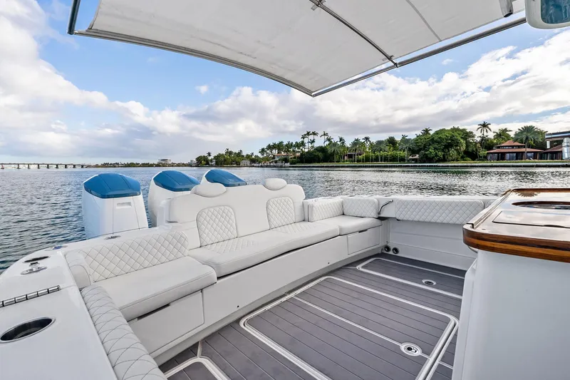Slide: The Image of Luxurious 2023 HCB 42 Lujo boat interior with plush seating and scenic waterfront view. - 14