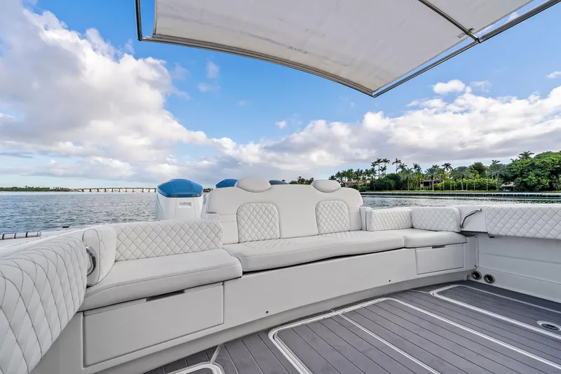 Slide: The Image of Luxurious seating on 2023 HCB 42 Lujo boat with scenic waterfront view. - 15