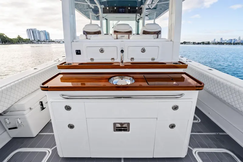 Slide: The Image of 2023 HCB 42 Lujo boat interior with sleek cabinetry and ocean view. - 19