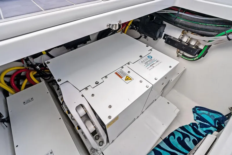 Slide: The Image of Engine compartment of 2023 HCB 42 Lujo boat with electrical components and wiring. - 21