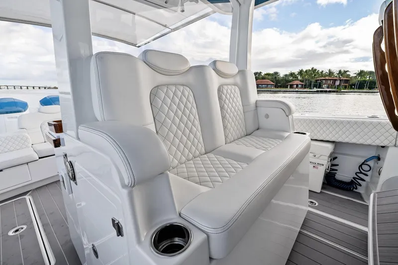Slide: The Image of Luxurious seating on 2023 HCB 42 Lujo boat with quilted white upholstery. - 22
