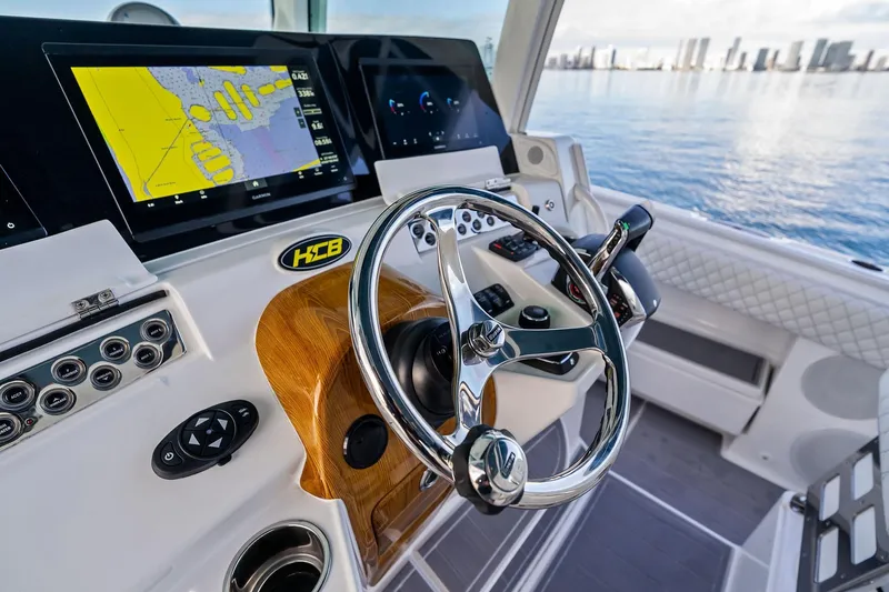 Slide: The Image of Helm of 2023 HCB 42 Lujo boat with advanced navigation displays. - 25