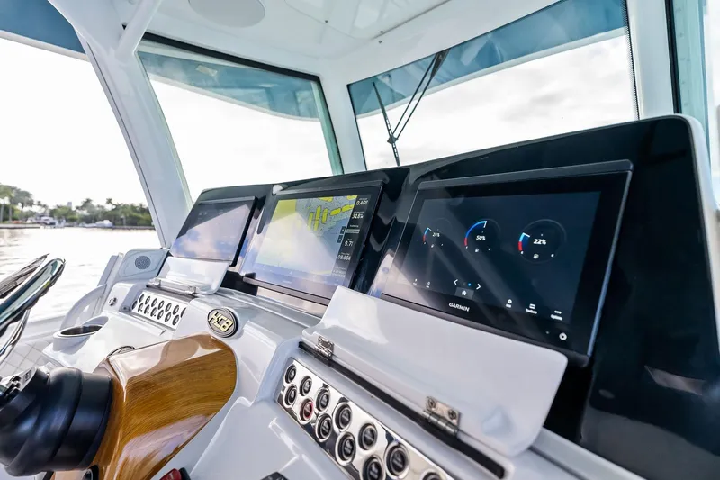 Slide: The Image of Helm of 2023 HCB 42 Lujo with advanced Garmin navigation displays. - 26